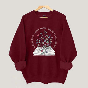 Teach Them Love Floral Book Sweatshirt