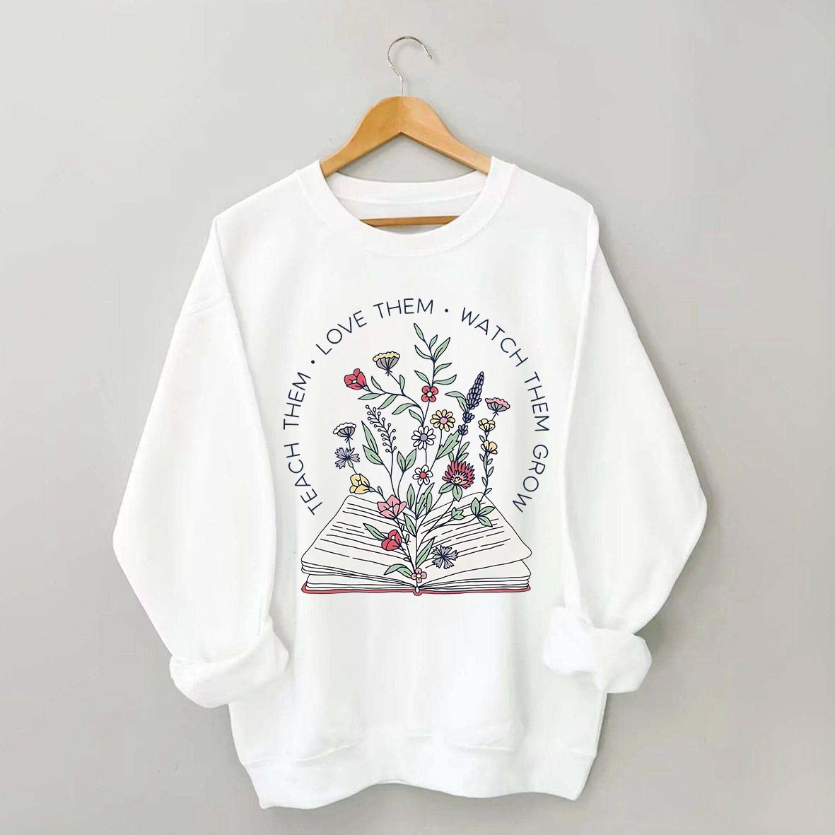 Teach Them Love Floral Book Sweatshirt