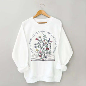 Teach Them Love Floral Book Sweatshirt