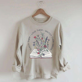 Teach Them Love Floral Book Sweatshirt