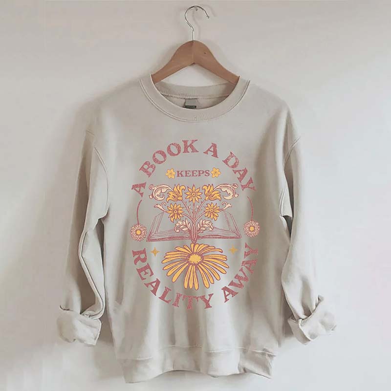 A Book A Day Keeps Reality Away Sweatshirt