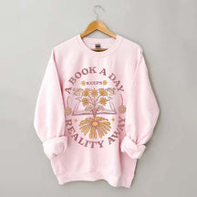 A Book A Day Keeps Reality Away Sweatshirt