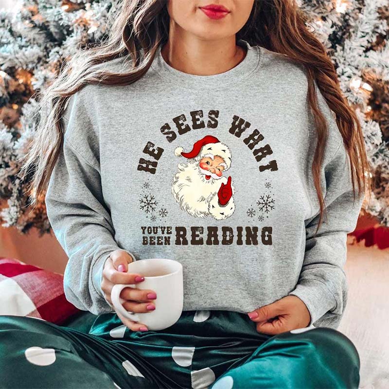 He Sees What You've Been Reading Santa Sweatshirt