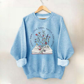 Teach Them Love Floral Book Sweatshirt