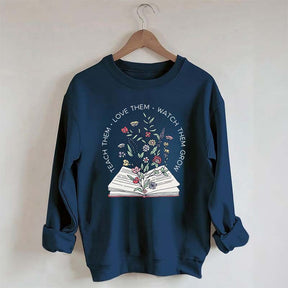 Teach Them Love Floral Book Sweatshirt